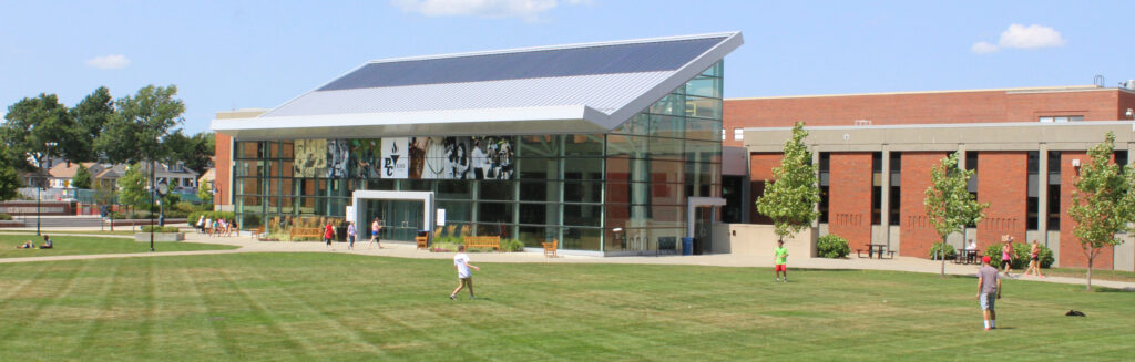 students playing frisbee on Slavin Lawn